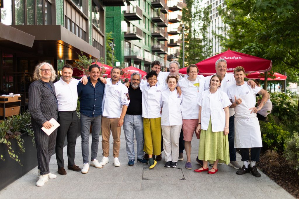 Group of food writers and critics in chef uniform at Too Many Critics fundraising event