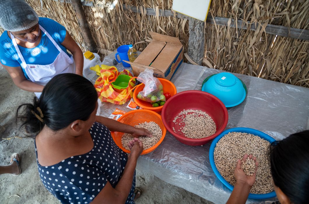 Women in Nepal preparing food.