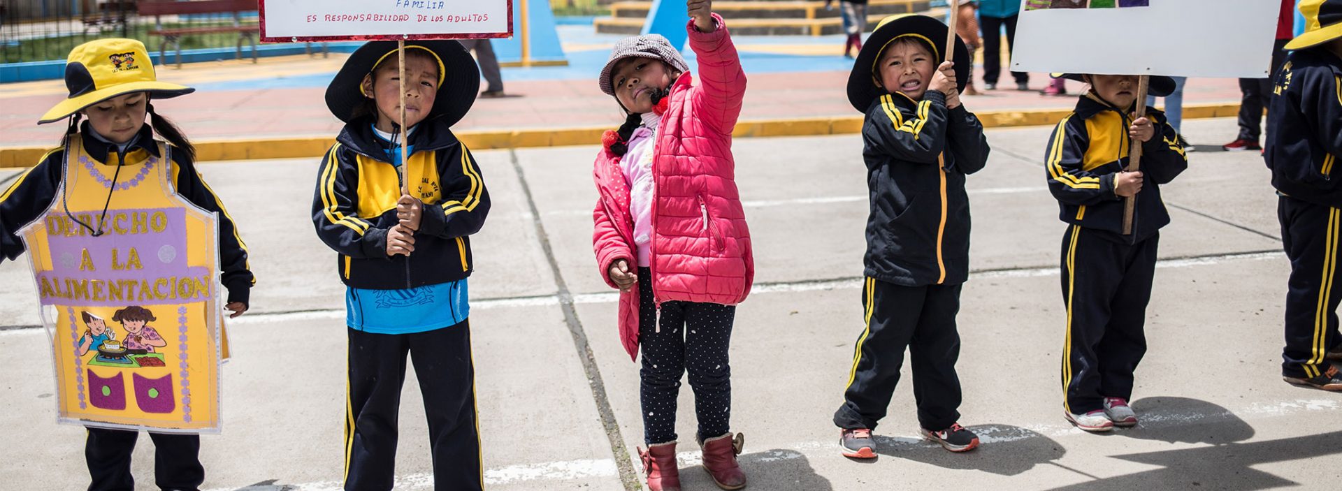 Children in Peri advocating for their right to food and nutrition during a community protest.