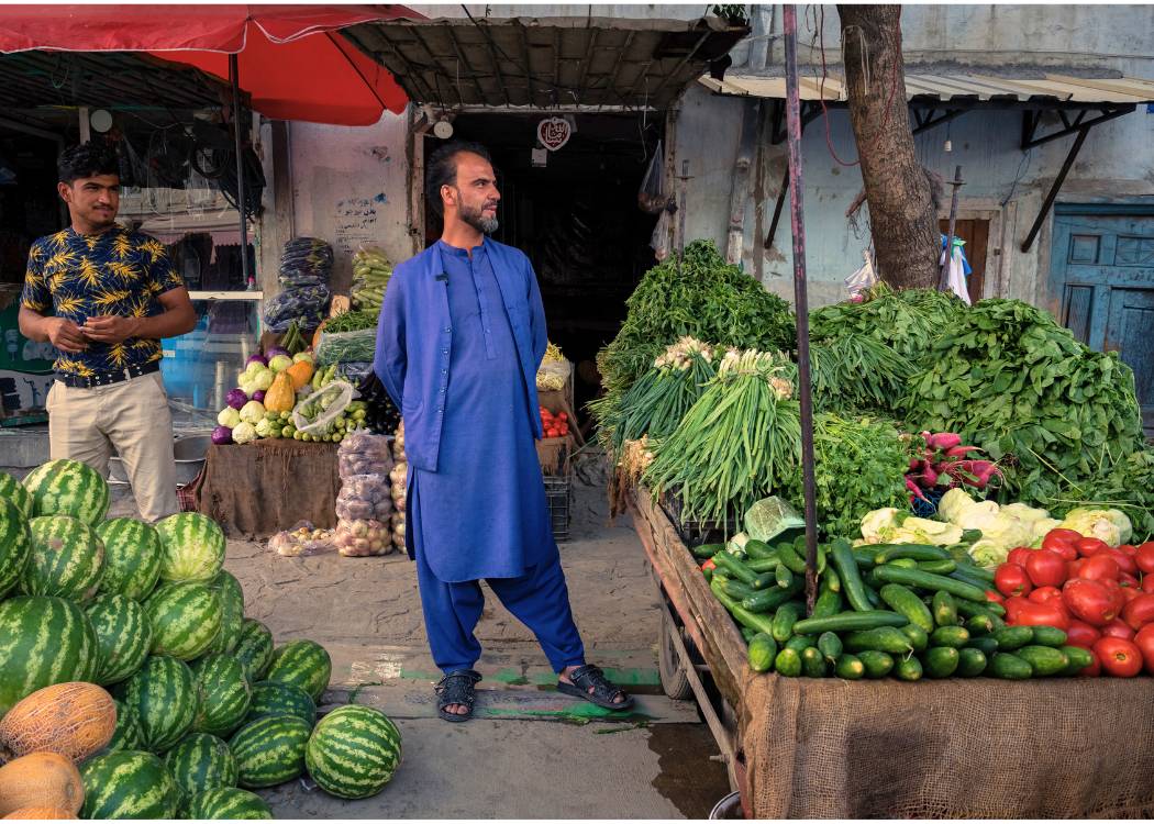 Safihullah in Afghanistan, outside his fresh food business.