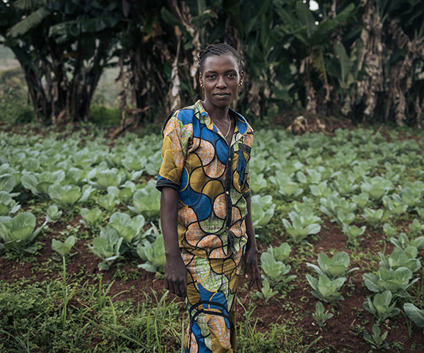 Alice in a cabbage field supported by Action Against Hunger in the Democratic Republic of Congo.