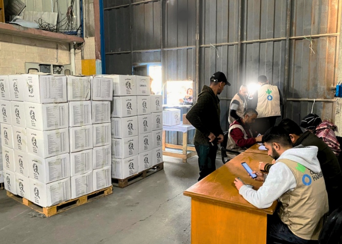Gaza aid workers giving out food parcels.