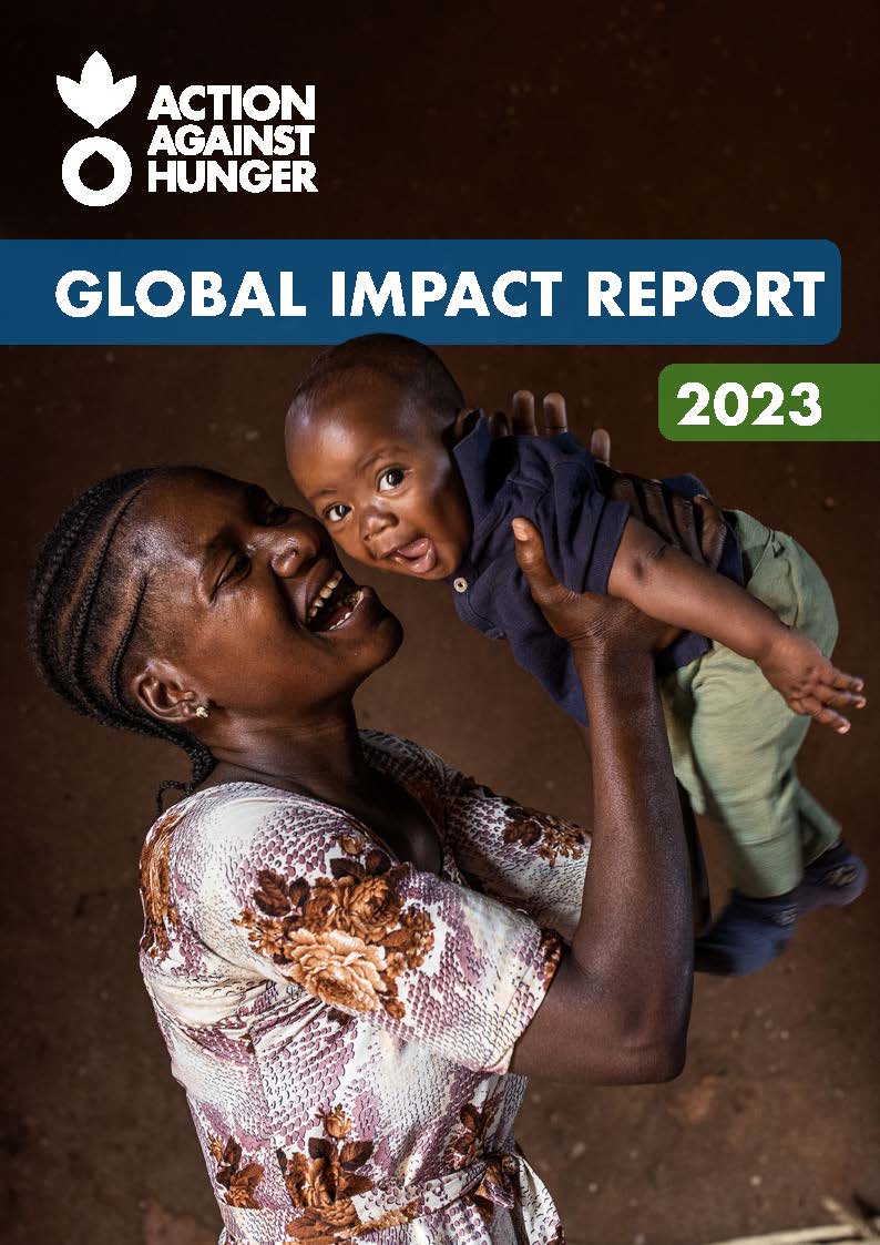 Cover of Global Impact Report with mother holding her child in air smiling.