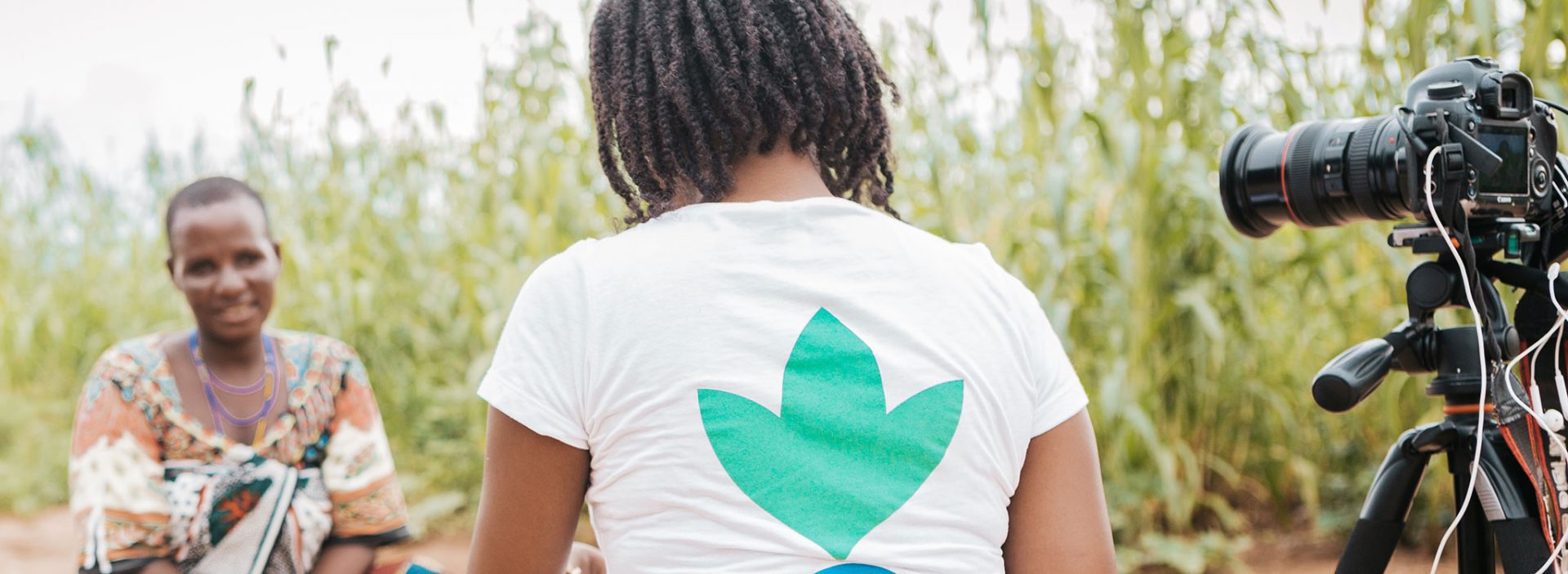 An Action Against Hunger communications officer interviews a woman in Tanzania.