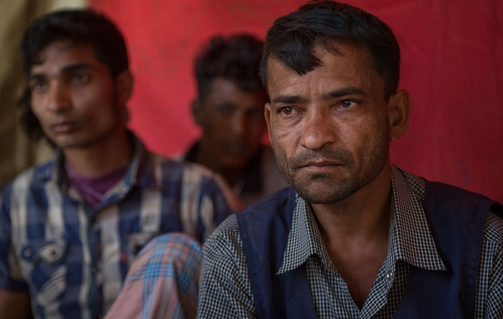 40 year old Mohammed Tayob among young men and adolescents at a men's stress management session in the Balukali camp